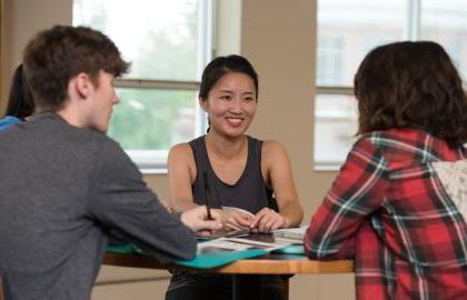 International students sitting around a table